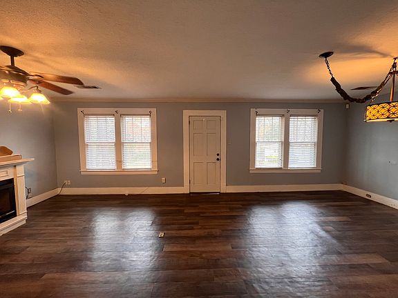 Living room with working fire place and dining area