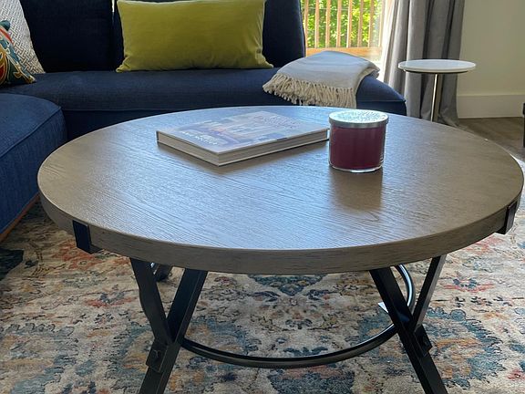 Living room coffee table with sliding glass doors to front deck