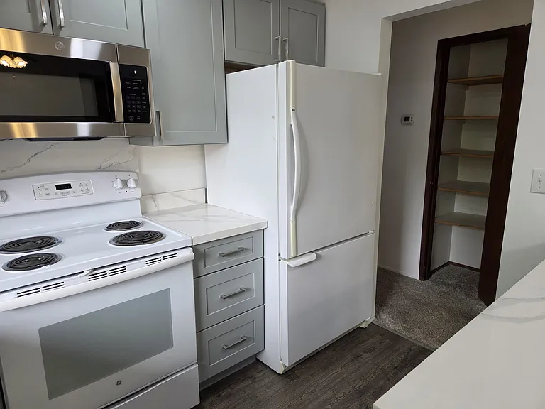 Kitchen with nice refrigerator and pantry