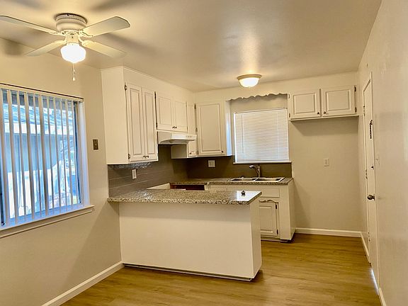 Kitchen with new granite countertops, flooring and stove which will be installed soon.