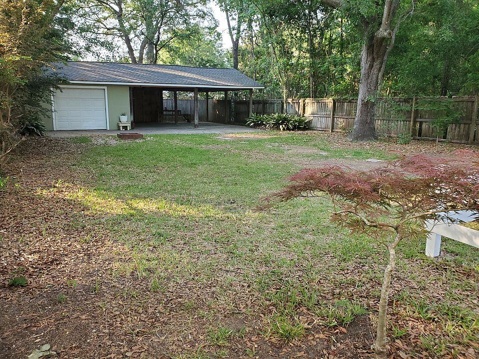 Huge backyard with awesome detached garage/carport that has power!