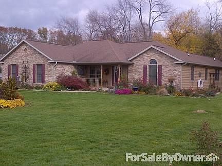 Front view w/porch for morning coffee
						:
						Brick front with cedar siding on remaing sides. Low maintenance- newly painted