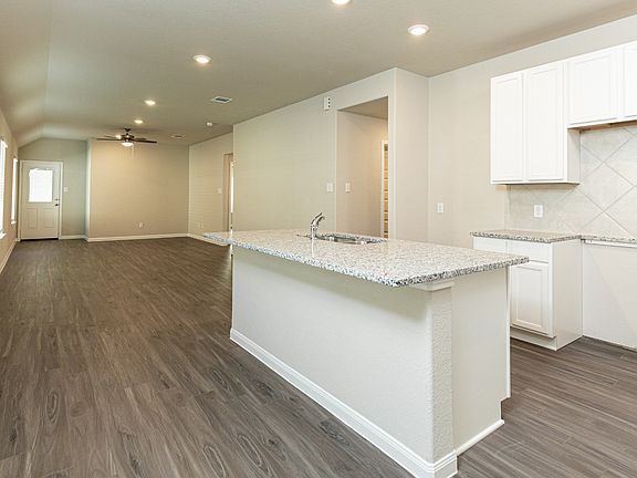 Kitchen to Dining Area and Family Room