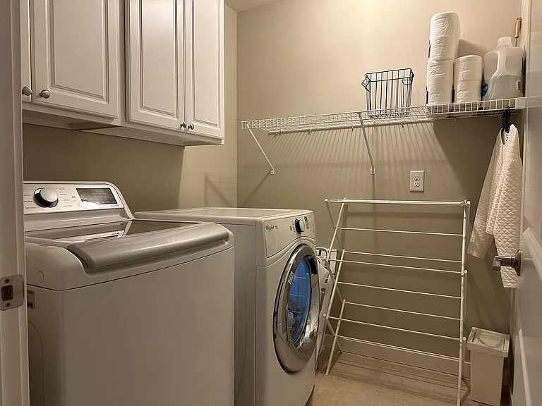 Washer room with cabinets