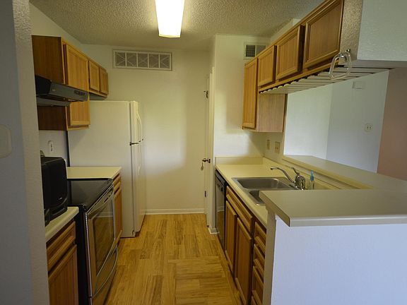 Galley Kitchen with bar opening & pantry closet