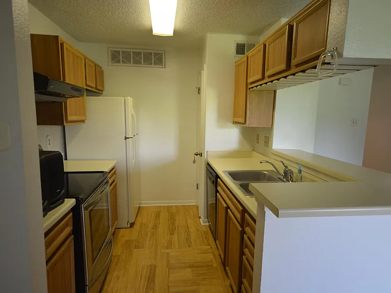 Galley Kitchen with bar opening & pantry closet
