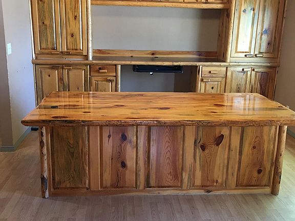 Living room with built in storage/entertainment center (desk not included).