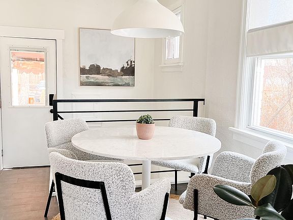 Dining area comes with marble pedestal table as shown in the photo