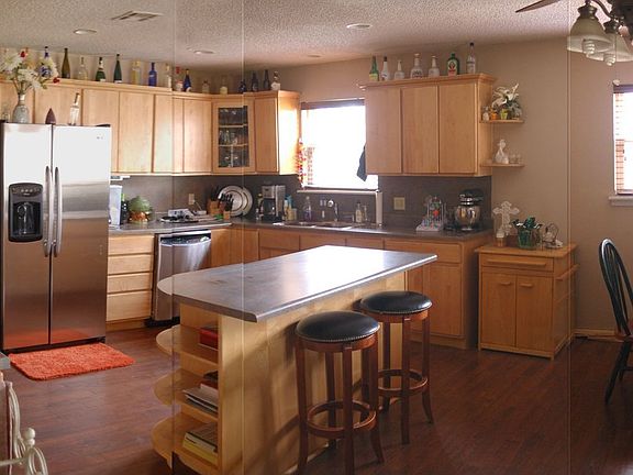 Kitchen (added wood floors in 2010 + new stainless dishwasher & microwave)
