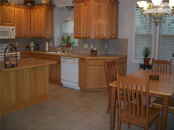 Eat-in-kitchen with tile floor.