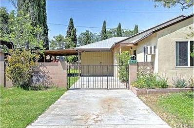 Long driveway, gated entrance.