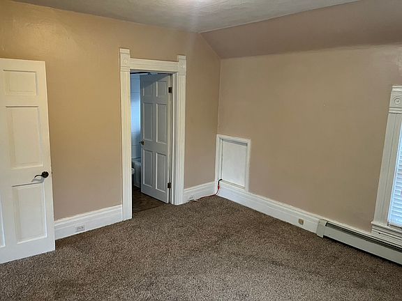 main room, facing north, view of bathroom door