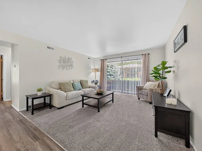 Open living room with natural light at Eastwood Village Apartments in Clinton Township, MI.