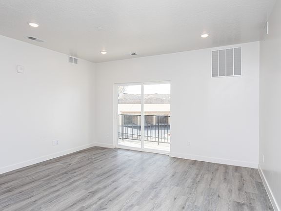 Three Bedroom Living Room + Patio Door