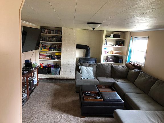 Family room with built-in shelves (wood-burning stove NOT to