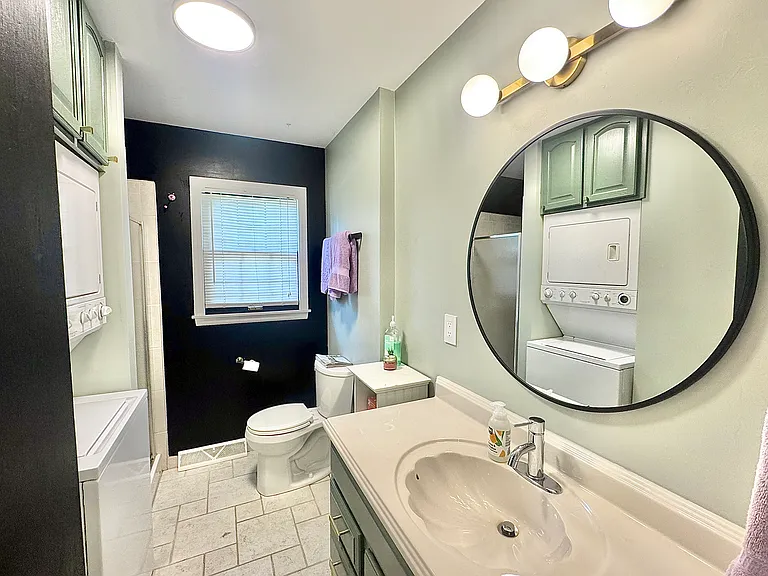 319 E 100th Ter — Photo 11