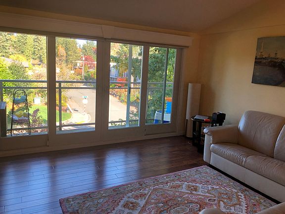 Living room with huge windows and awesome park view - a rare luxury in Bellevue