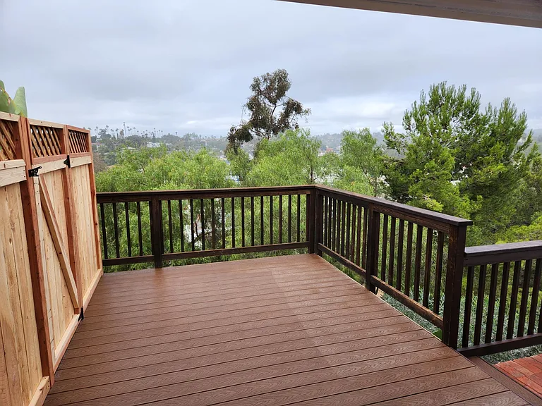 Deck provides expanded living space with great views and greenery.