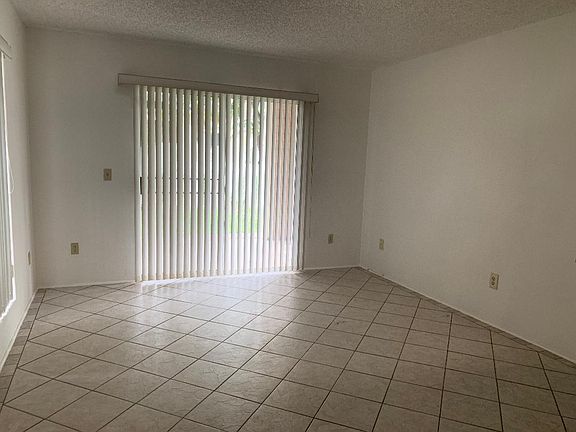 Upon entry, living room is on the left and the sliding door leads to patio or outside yard.