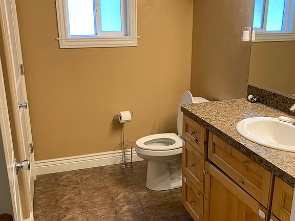 Master bathroom with full linen closet and a window