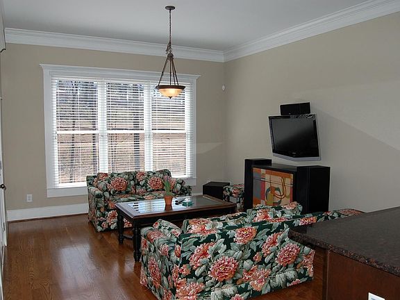 Bright family room open to living room and kitchen
