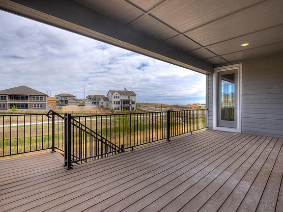 Covered Deck with Stairs to Backyard