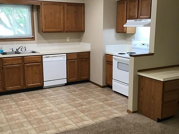 Kitchen view including dish washer and stove.