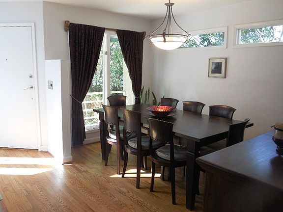 Separate dining room adjacent to the kitchen with a small pass through