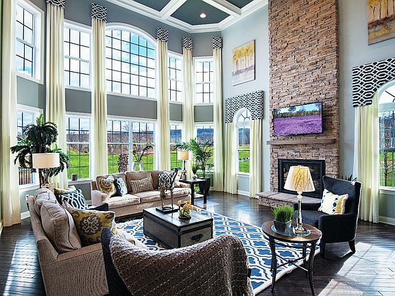 Two-Story Family Room with Fireplace and Wall of Windows