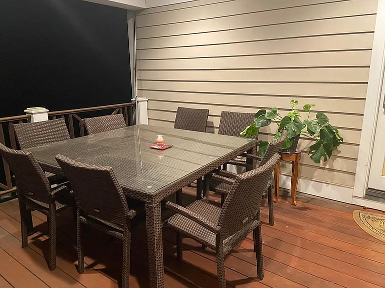 Family room and living room both open to back deck; stairs down to back yard.