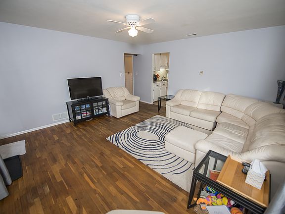 This spacious area features updated ceiling fan, newer windows, and neutral paint.
