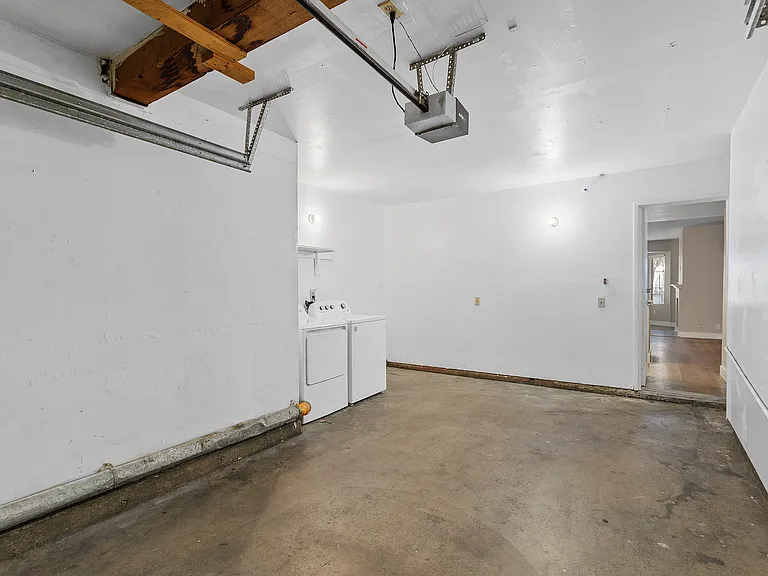 An attached private garage adds everyday convenience and peace of mind.