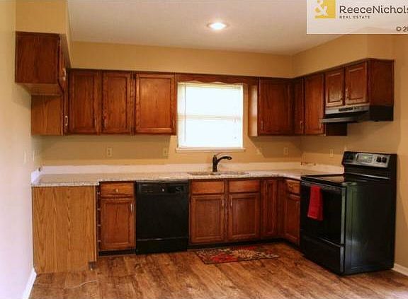 Kitchen with brand new granite countertops and hardware.