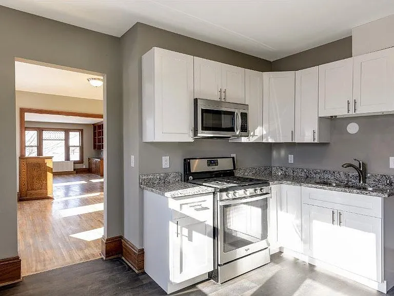 Updated bright kitchen with stainless steel appliances