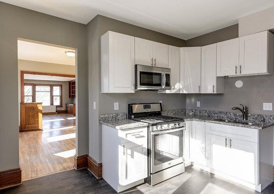 Updated bright kitchen with stainless steel appliances