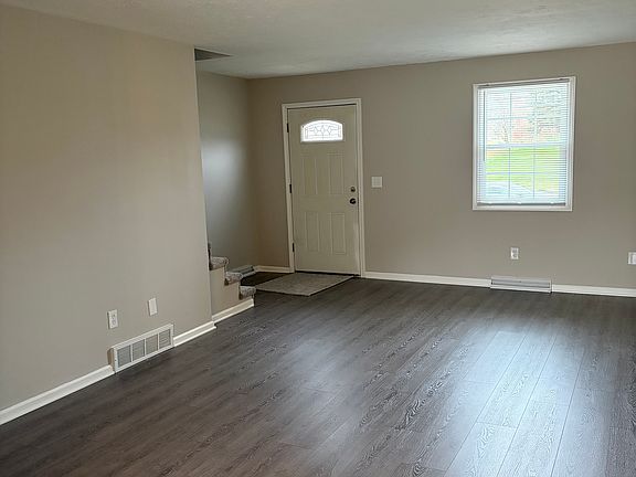 Spacious living room with attractive luxury vinyl plank flooring.