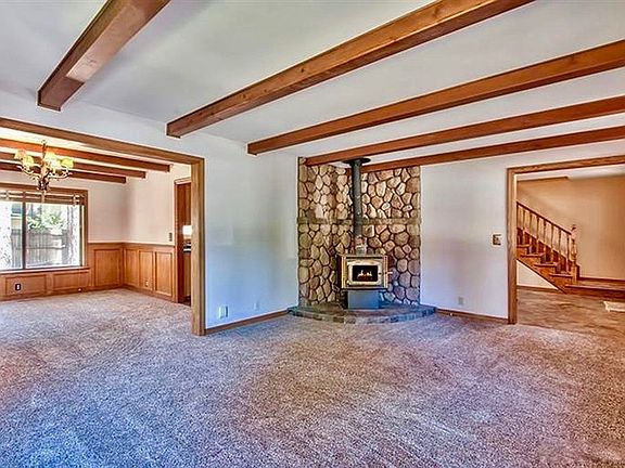Living room. Now has new gas stove.