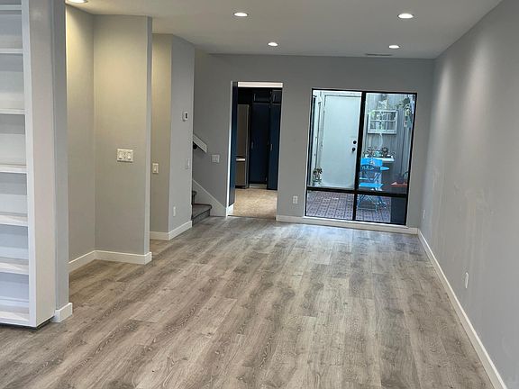 living room/dining room looking towards kitchen/interior atrium.