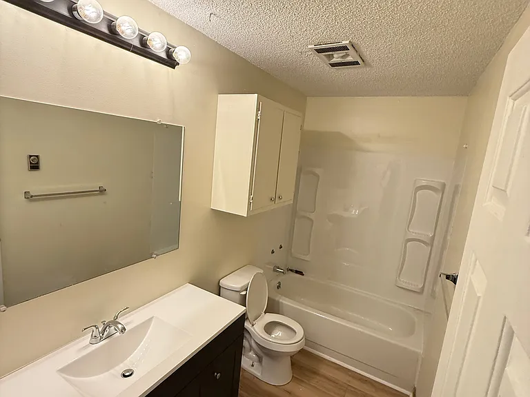 Bathroom with large vanity, updated shower