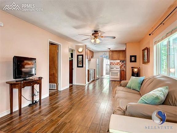 Beautiful floors lead the way to the kitchen.