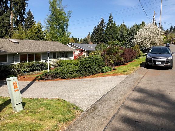 House with neighbor and street