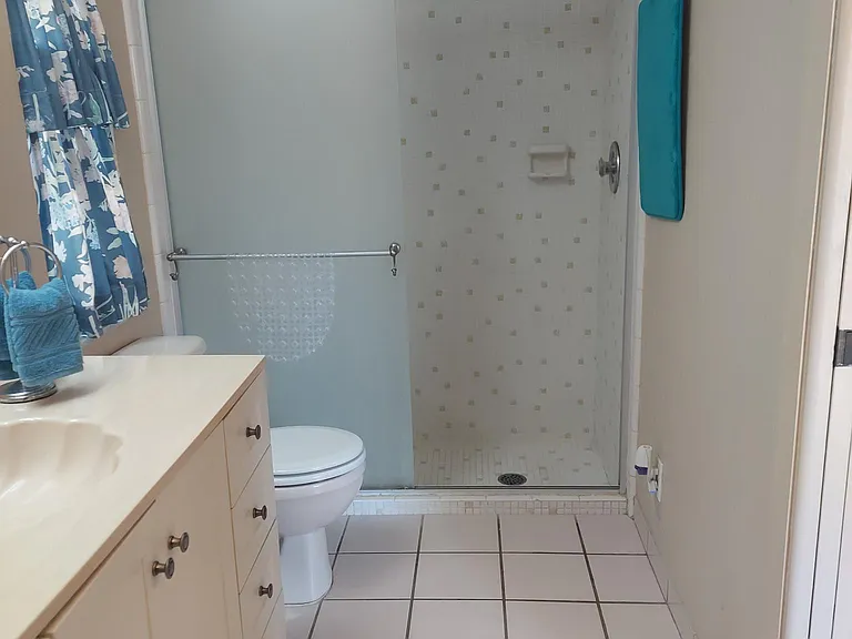Bathroom with walk in shower.