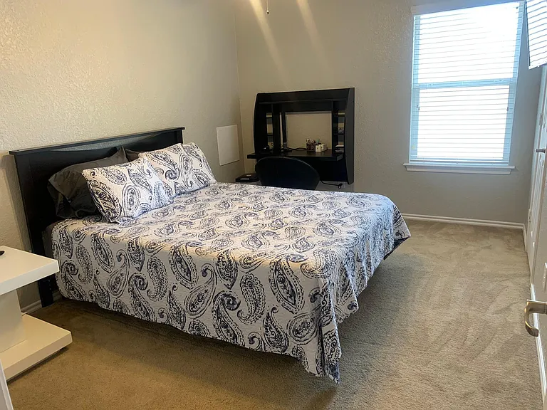 Bedroom 3 has a queen size bed, a desk for a 3rd work from home option, Roku TV, ceiling fan and walk in closet.