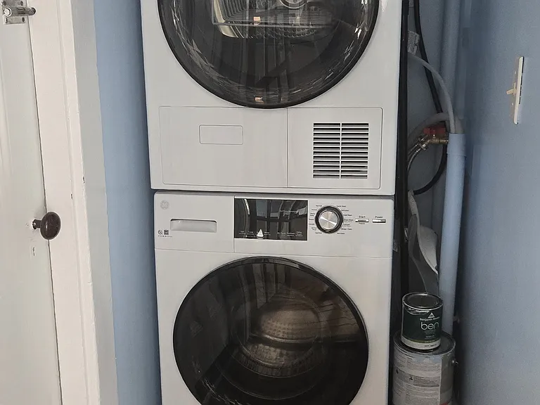 Washer and dryer are in a closet off of kitchen.