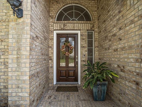 COME ON IN TO SEE THE UPDATES GALORE! The front porch offers a glass pane wood stained front door with a full brick entryway! The home is equipped with a a ring doorbell which will remain with the home!