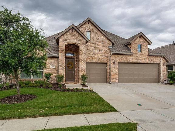 Nice welcoming bricked front entry. Landscaped. HOA maintains the front grass.