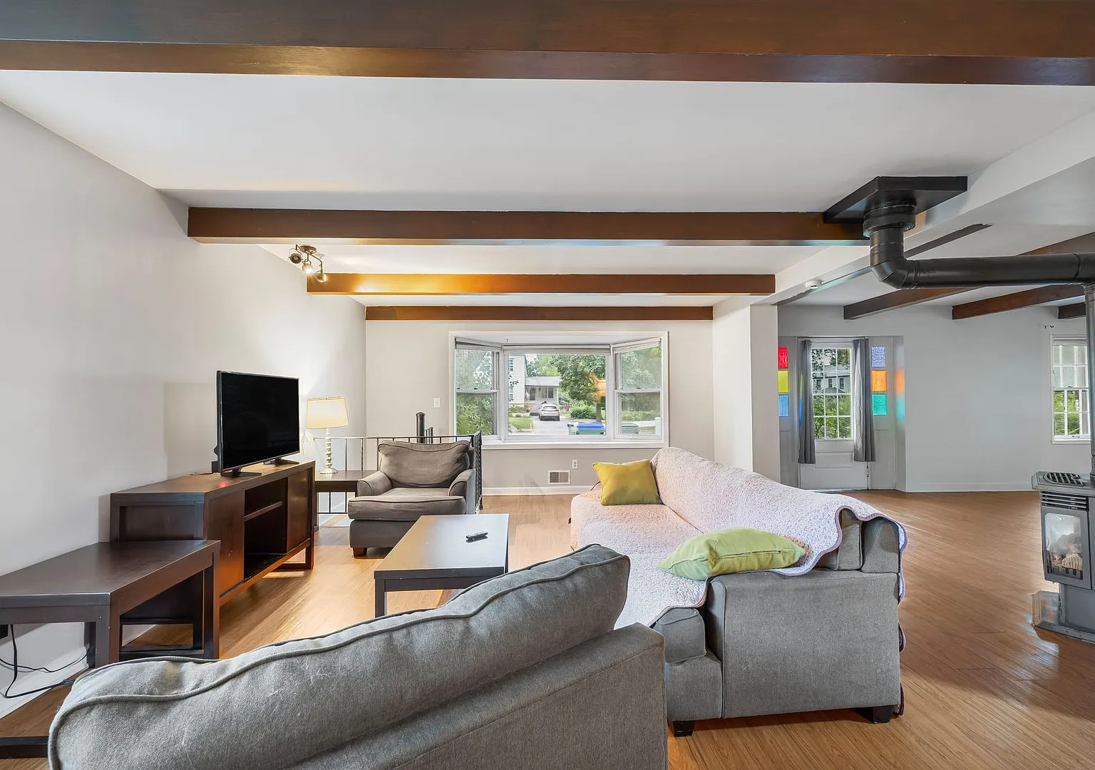 Home-Like Living with Sunroom, Attached Garage & In-Unit Laundry — Photo 2
