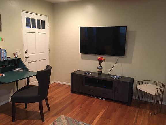 Living room, with wall-mounted desk and high speed wifi