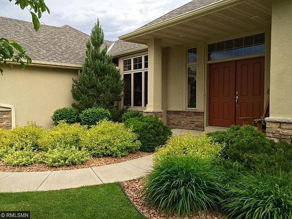 Professionally landscaped front and back sited on a partially heavily wooded 1/5 acre lot for added privacy.