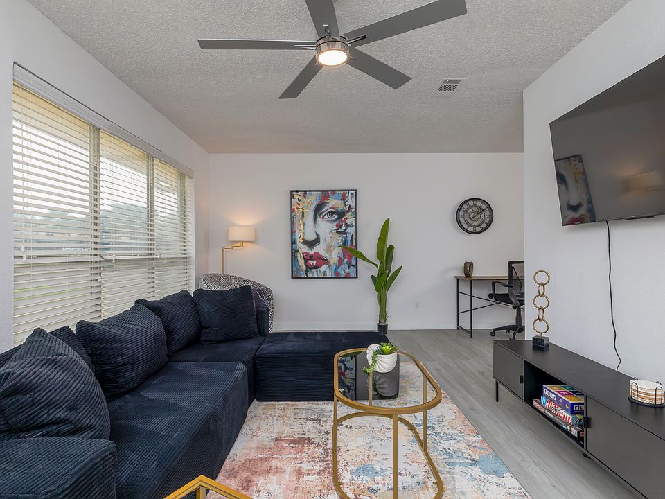 Spacious living room with plenty of seating for friends and family.